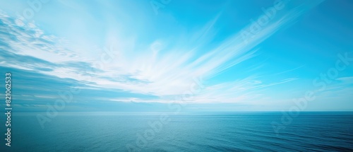 Serene Ocean Horizon at Dawn with Blue Skies