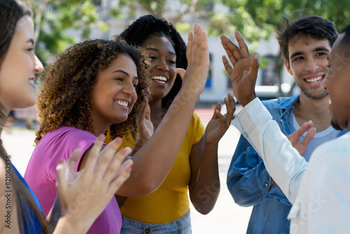 Wallpaper Mural Group of latin american and black and  caucasian volunteers giving high five Torontodigital.ca
