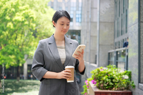 Free Download Professional Woman Using Smartphone on Coffee Break - GFXLoad