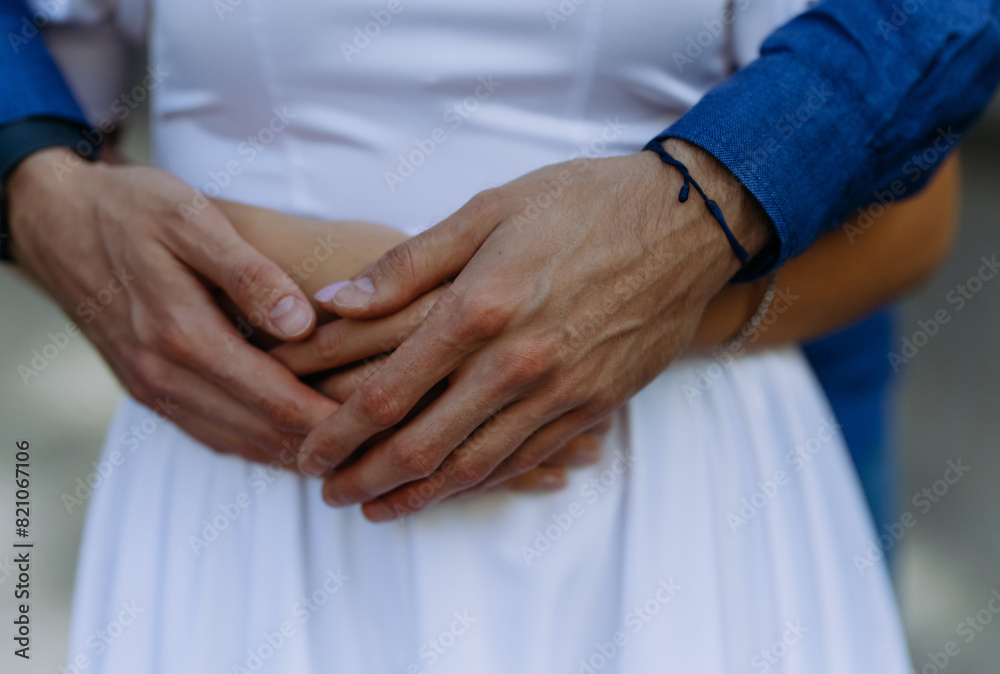 Close up of reconciled husband and wife holding hands showing support and love, couple making up after quarrel, man hugging woman, hugging and caressing Close up of reconciled husband and wife holding hands showing support and love, couple making up after quarrel, man hugging woman, hugging and caressing