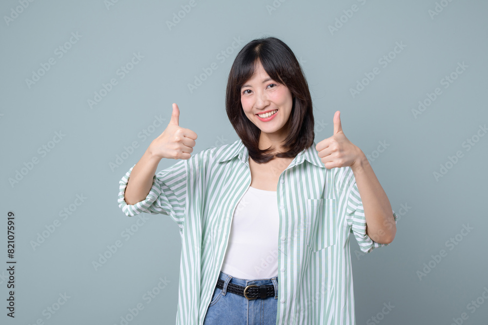 Very good. Smiling asian enterpriser woman showing okay with satisfied face expression, praise and compliment great job, pleased by smth, standing over pastel green background Very good. Smiling asian enterpriser woman showing okay with satisfied face expression, praise and compliment great job, pleased by smth, standing over pastel green background