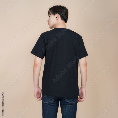 Young man posing in casual black t-shirt