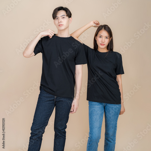Stylish couple posing in plain black t-shirts