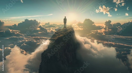 A man stands on a top of the mountain representing leadership and achievements  photo