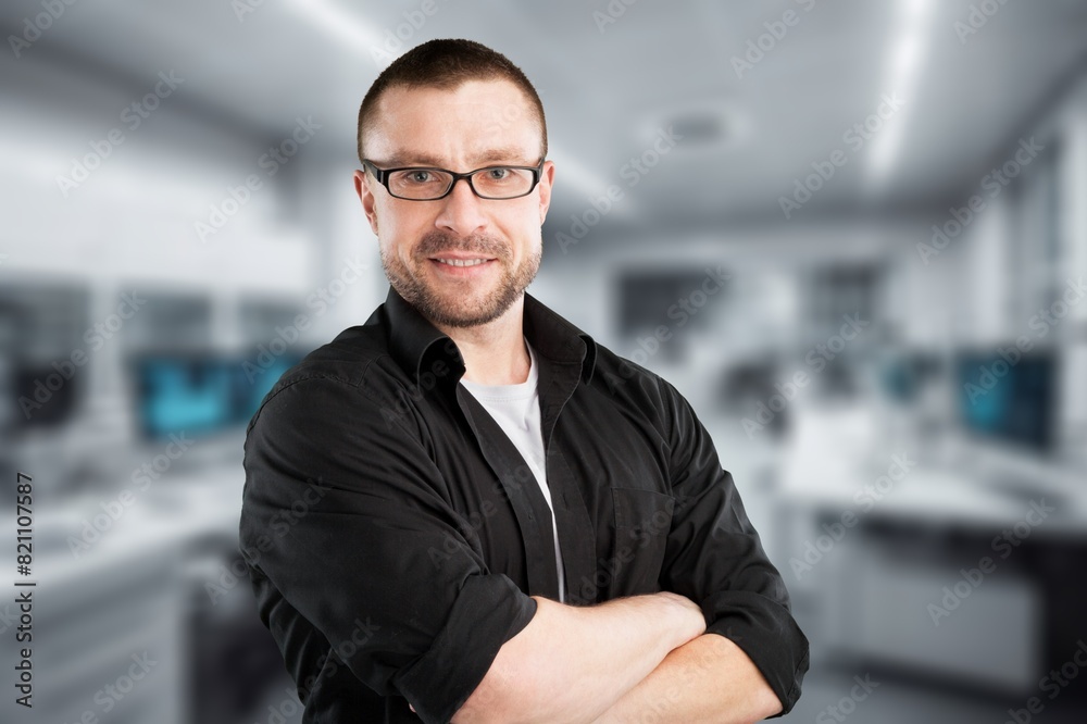 Happy smiling business man posing in office Happy smiling business man posing in office