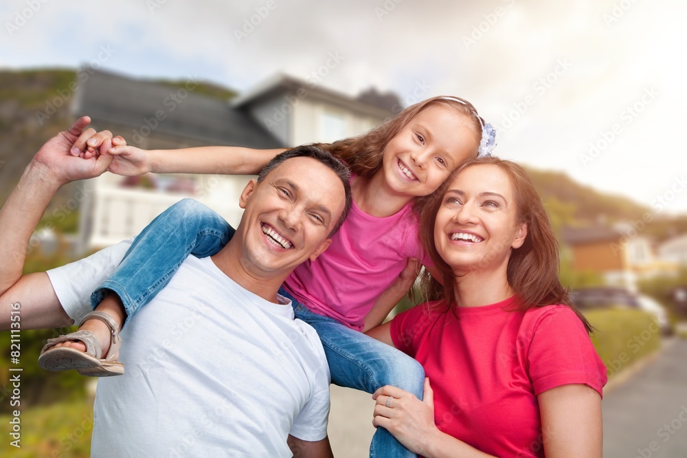 Happy young Family with kids together in a garden Happy young Family with kids together in a garden