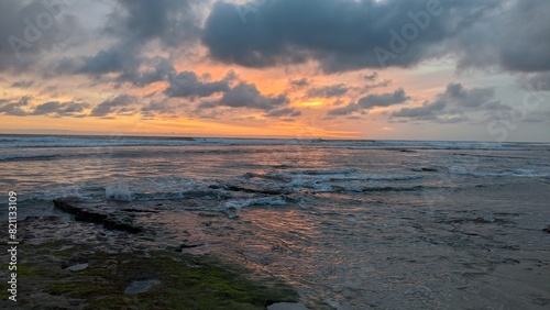 The Multi Cultural Rocks of Swamis Beach. Rounded and polished from tumbling in fast streams and ocean waves rocks of many geo ethnic origins together at Swamis Reef Surf Park Encinitas California. © actionX