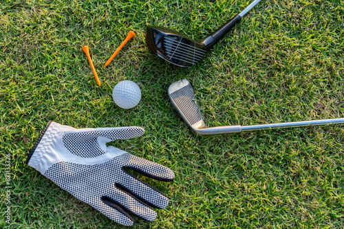 Golf balls on the golf course with golf clubs ready for golf in the first short