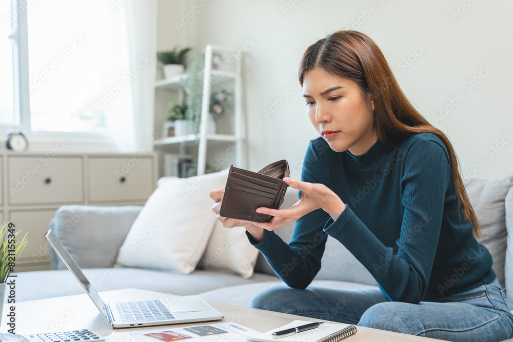 young asian woman cover her face after stressed with monthly bill expenses and credit card debt. young asian woman cover her face after stressed with monthly bill expenses and credit card debt.