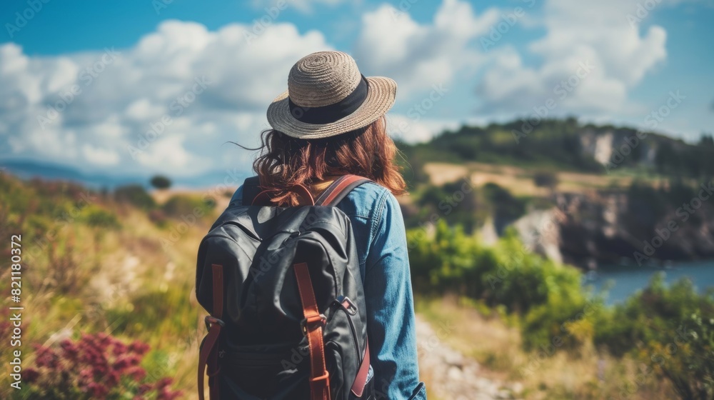 A woman with a hat and backpack standing on the side of a trail, AI A woman with a hat and backpack standing on the side of a trail, AI