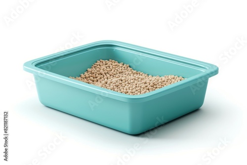 A blue plastic container with cat litter in it photo