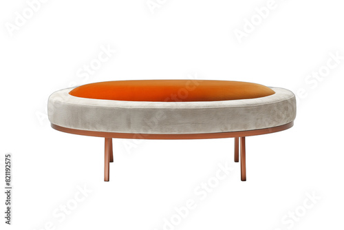 Round upholstered fabric ottoman with orange cushion on white background