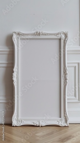 small white thin frame on light wooden floor, horizontal orientation