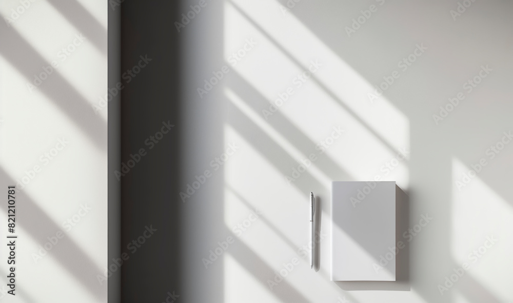 Obraz premium Simple notepad with white paper, placed on a white background, with natural shadows that accentuate its texture and thickness. Empty notebook ready to be filled. AI generated
