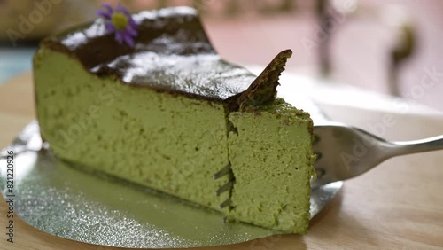 Close up Footage of Person Using Fork to Eat Green Tea Cheese Cake