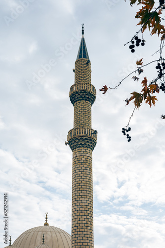 Elegant mosque minaret against a clear sky