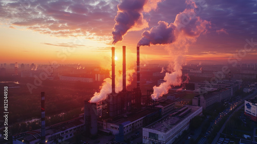 Industrial Factory with Smokestacks Emitting Pollution at Sunset