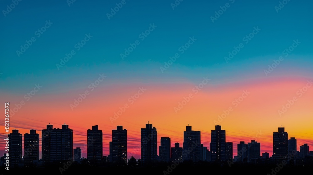 City Skyline Silhouetted Against Colorful Sunset