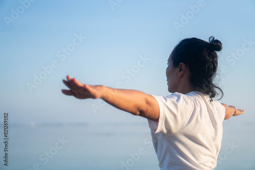 healthy woman with beautiful body doing yoga at sunrise on the beach, yoga poses