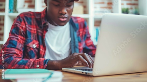 Man Using Laptop Computer at Table