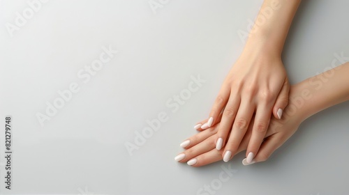 Interlocked Hands on White Surface