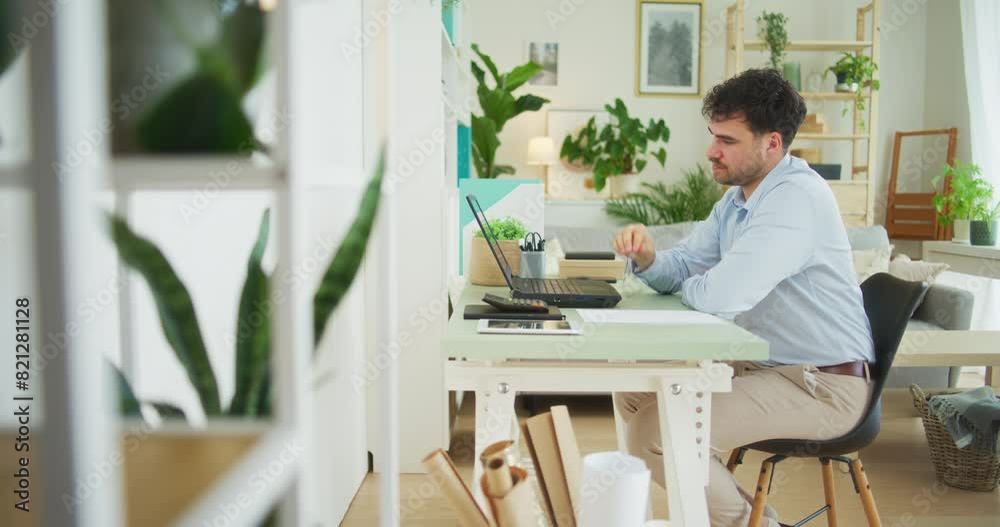 Overworked Businessman Distracted While Working Overworked Businessman Distracted While Working