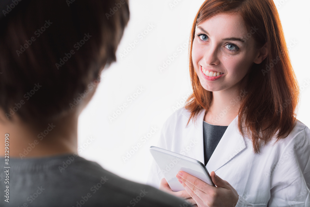 Auburn-haired woman, lab coat, tablet, gentle expression Auburn-haired woman, lab coat, tablet, gentle expression