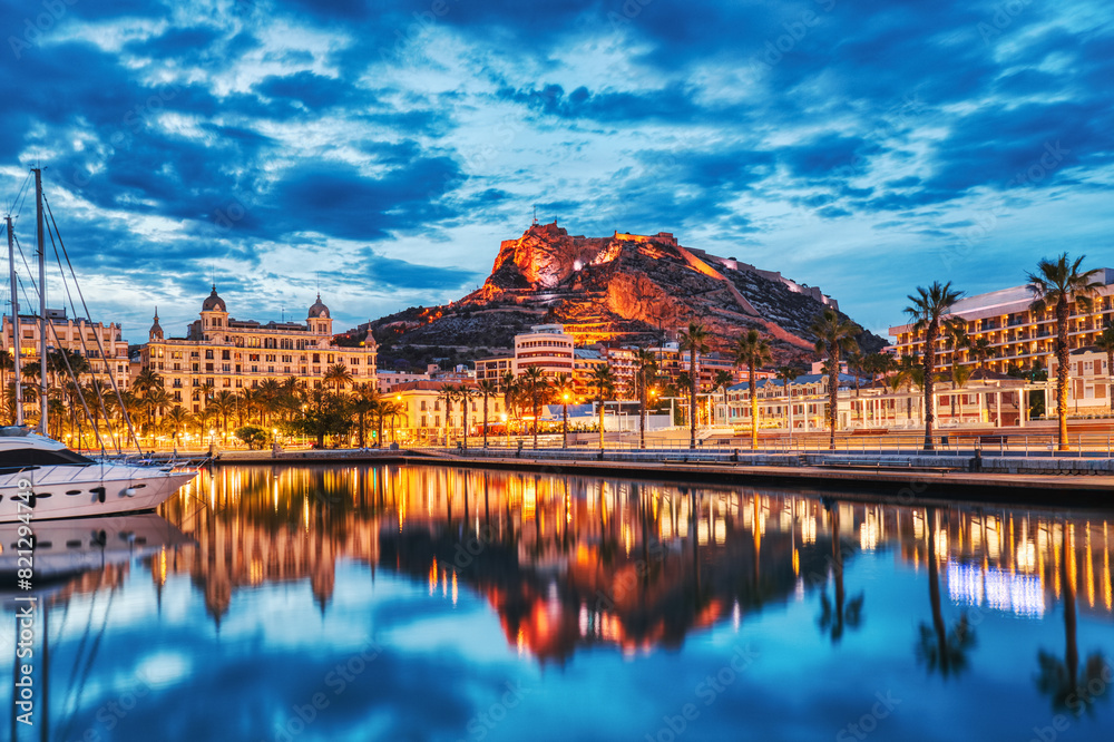 Fototapeta premium Illuminated Alicante Old Town Panorama at Dusk with Santa Barbara Castle and Harbor
