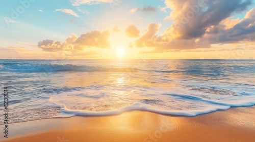 Summer Beach Sunrise with Warm Golden Hues and Gentle Waves in a Wide Angle Shot Capturing the Beauty of a Tranquil Morning Seascape.