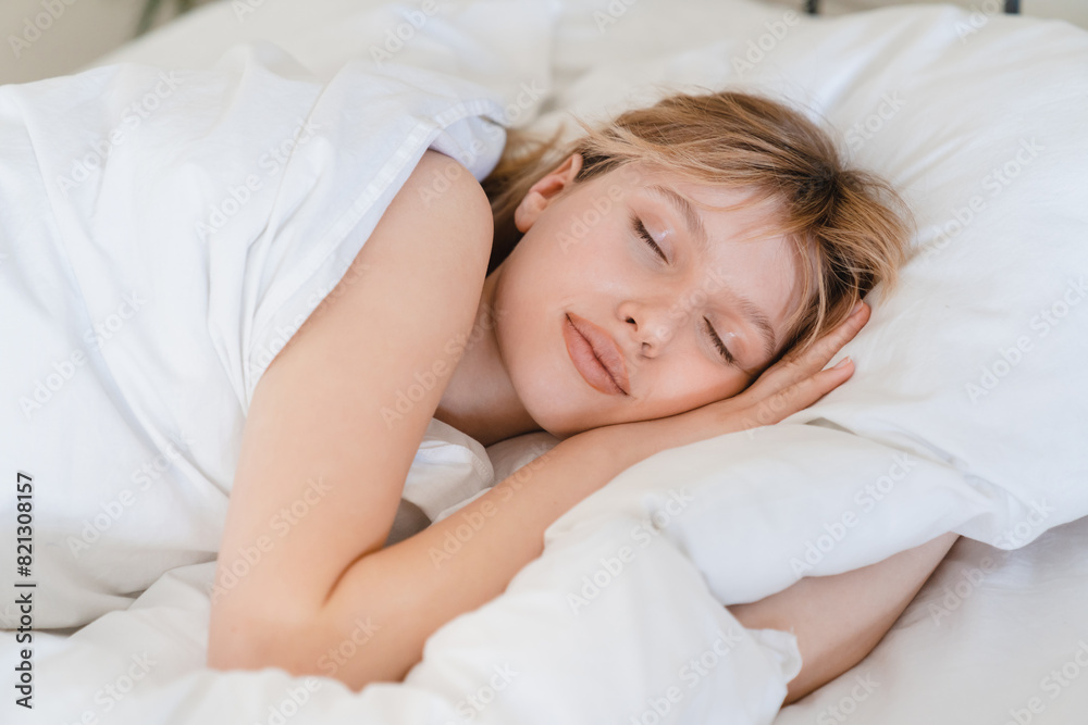 Healthy long dream, comfortable bed with white linen and orthopedic mattress. Young caucasian woman sleeping in the bed, relaxed calm dreams Healthy long dream, comfortable bed with white linen and orthopedic mattress. Young caucasian woman sleeping in the bed, relaxed calm dreams