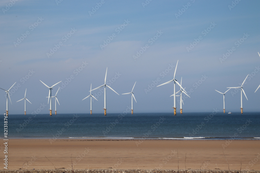The coast at Redcar, Uk showing the wind farm just off the coast of Redcar.