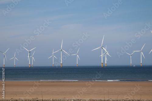 Obraz na płótnie The coast at Redcar, Uk showing the wind farm just off the coast of Redcar. w salonie