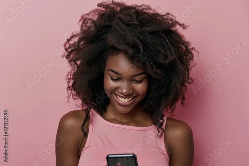 Woman Smiles at Cell Phone