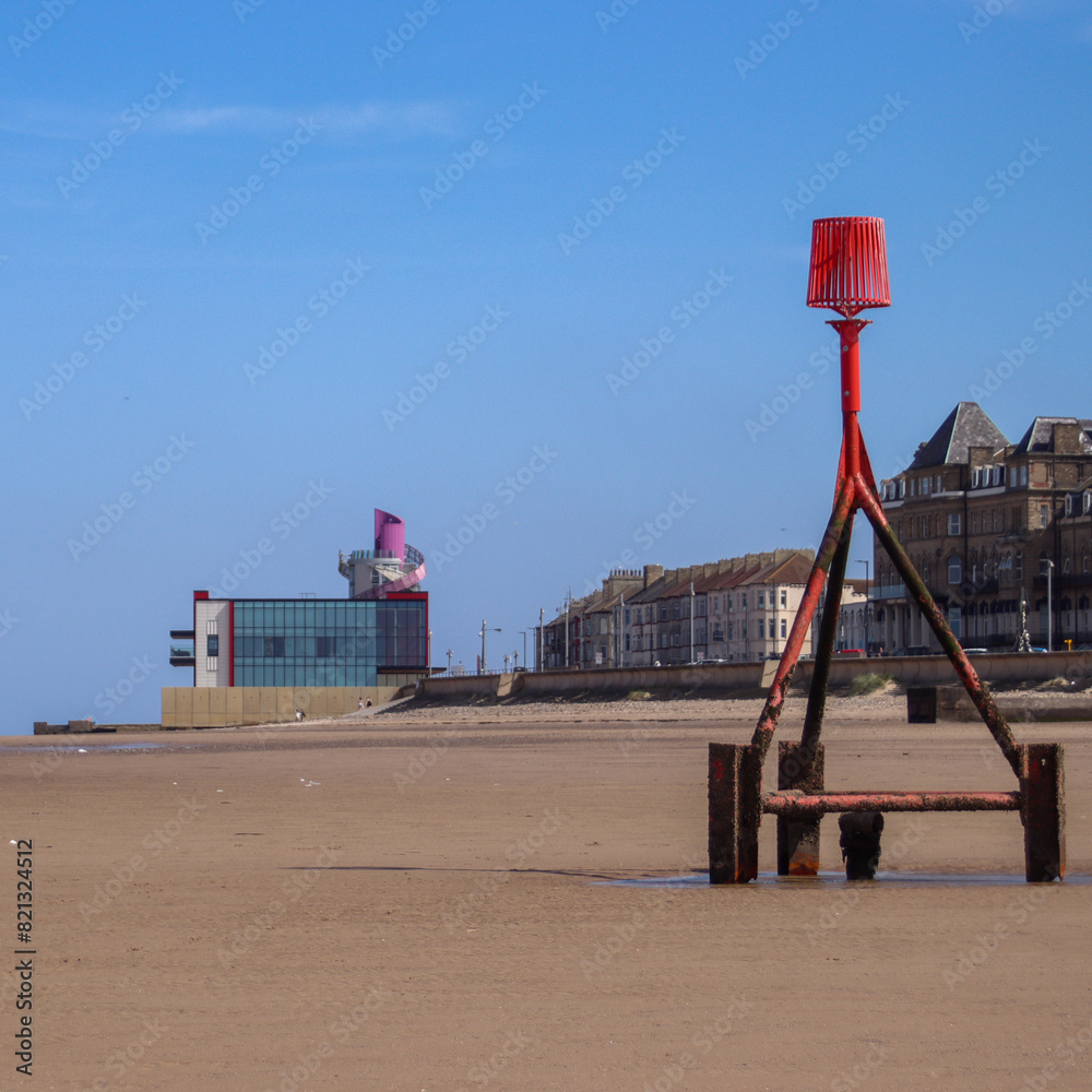 The north east costal town of redcar showing the vertical pier on the back ground.