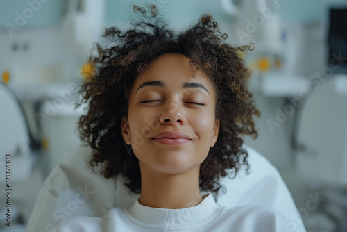 Relaxed young woman smiling in dental office