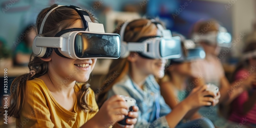 The image shows a group of children wearing virtual reality headsets in a classroom. The image shows a group of children wearing virtual reality headsets in a classroom.