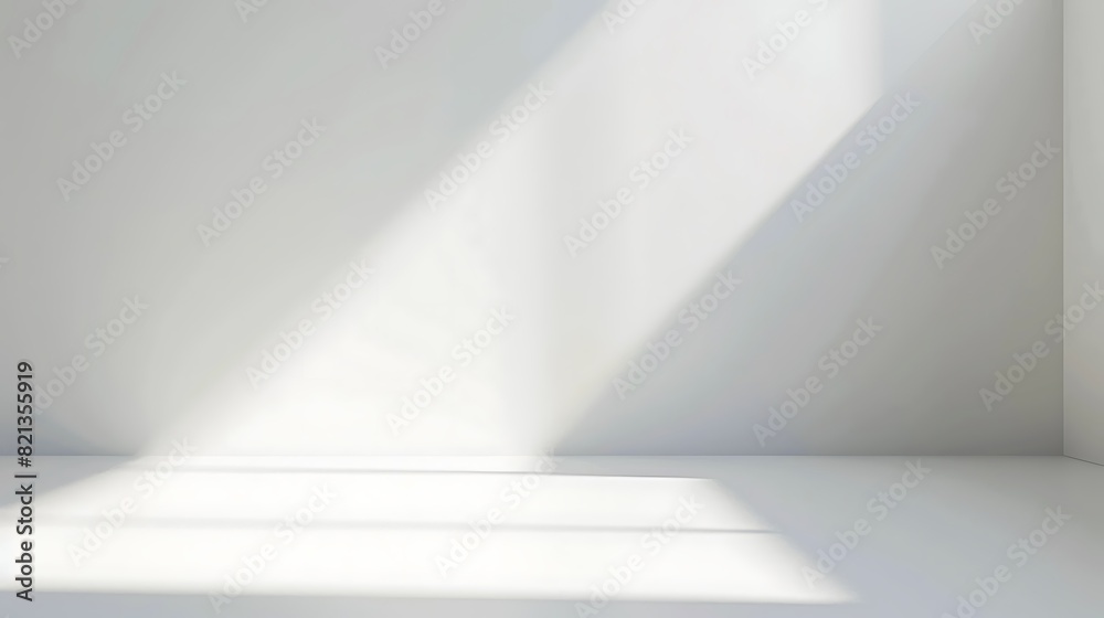 The photo shows a white wall with a spotlight shining on it. The spotlight is creating a triangle of light on the wall.