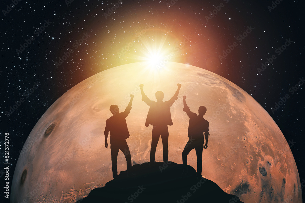 Fototapeta Silhouette of three people against the background of Mars. Elements of this image furnished by NASA