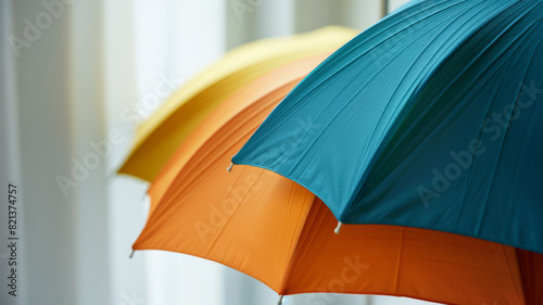 Colorful umbrellas   blue  orange  and yellow   close-up view