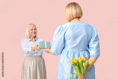 Mature woman greeting her d...