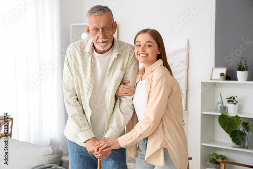 Female caregiver helping se...