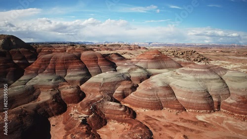 Aerial flyover view of colorful Bentonite Hills / Caineville, Utah, United States