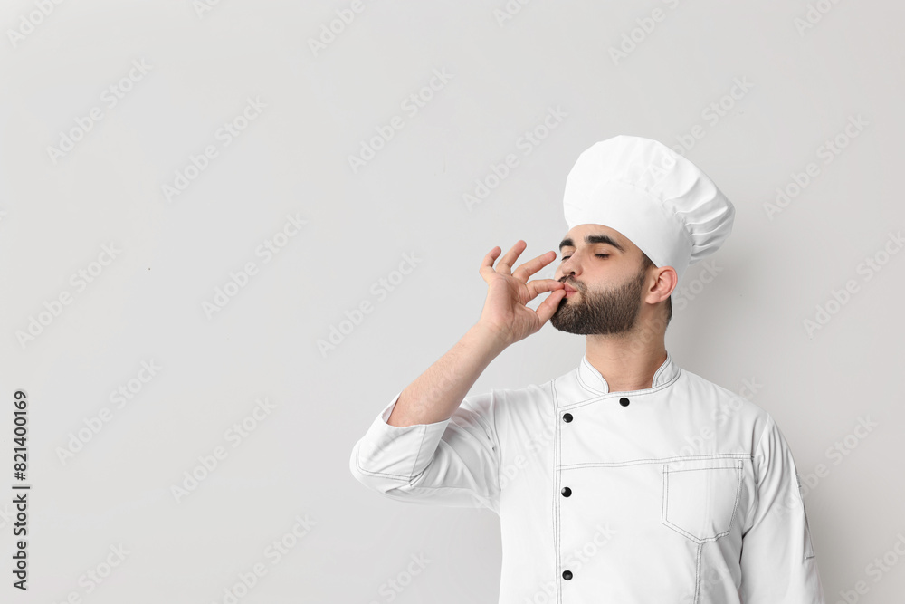 Professional chef showing perfect sign on white background Professional chef showing perfect sign on white background