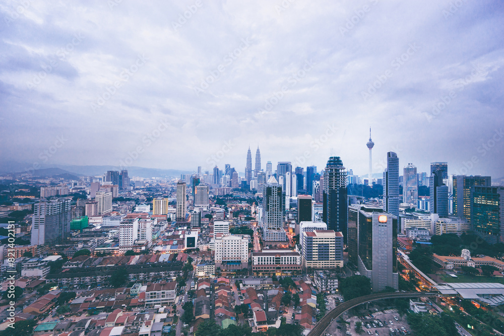 Beautiful cityscape with cloudy sky and skyscrapers. Megapolis Kuala-Lumpur, Malaysia. Beautiful cityscape with cloudy sky and skyscrapers. Megapolis Kuala-Lumpur, Malaysia.