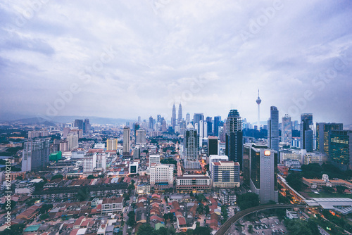 Beautiful cityscape with cloudy sky and skyscrapers. Megapolis Kuala-Lumpur, Malaysia.