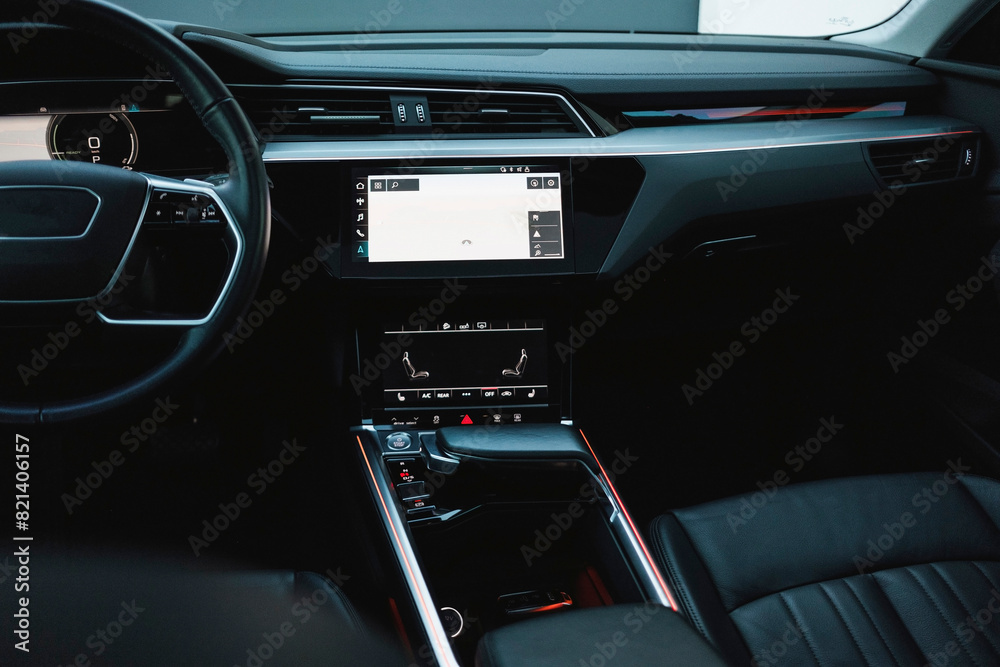 Modern black subcompact electric crossover SUV with black interior. Details interior. Modern black subcompact electric crossover SUV with black interior. Details interior.