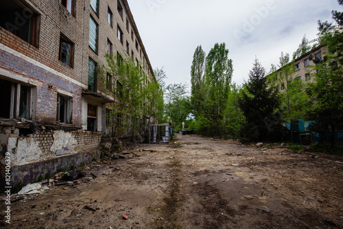 Abandoned white brick multistory houses, decaying cityscape of ghost town