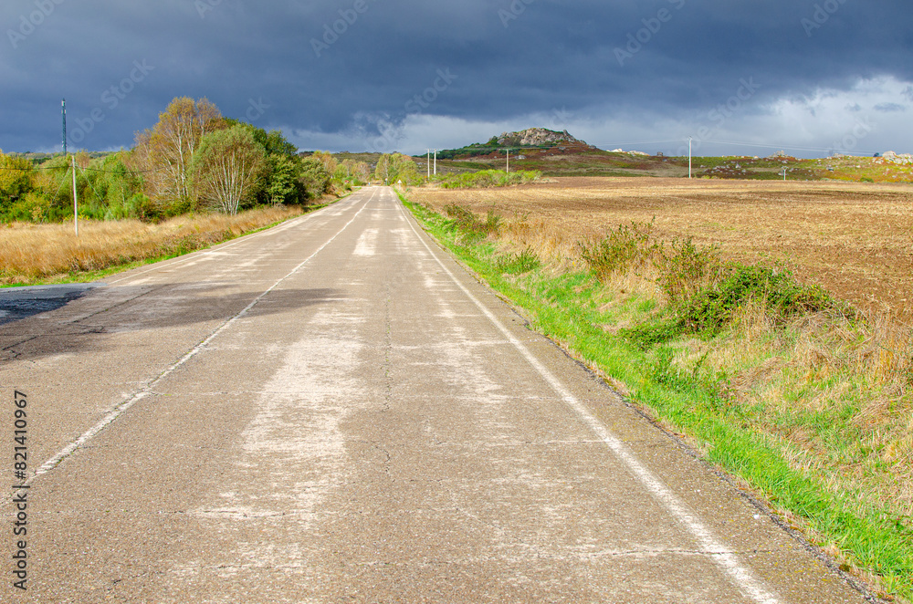 straight empty road on an overcast day straight empty road on an overcast day