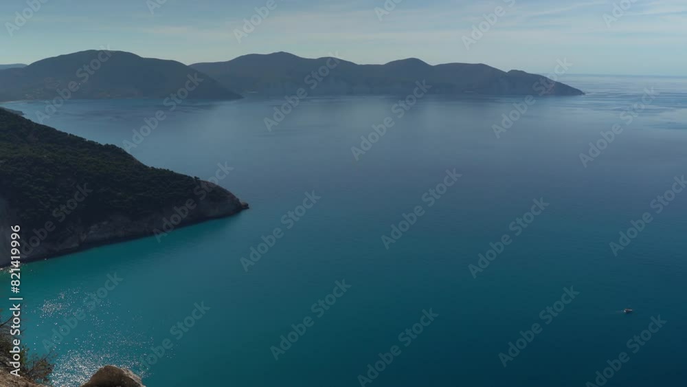 Top view drone shot of the famous Myrtos beach on Kefalonia island, Ionian sea, Greece. Myrtos beach with turquoise sea water on Cephalonia Greek island Top view drone shot of the famous Myrtos beach on Kefalonia island, Ionian sea, Greece. Myrtos beach with turquoise sea water on Cephalonia Greek island