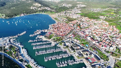 Aerial high quality view of Izmir tourist village Sigacik, its historical castle, fishing shelter and Teos marina photo